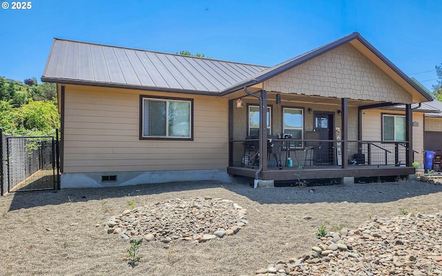 5135 Grange Rd, Roseburg, OR 97471 - rear view of house featuring metal roof, a porch, crawl space, and a standing seam roof