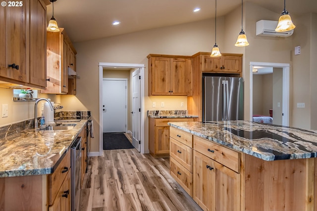 5135 Grange Rd, Roseburg, OR 97471 - kitchen with stainless steel appliances, a sink, a wall mounted air conditioner, vaulted ceiling, and light wood finished floors