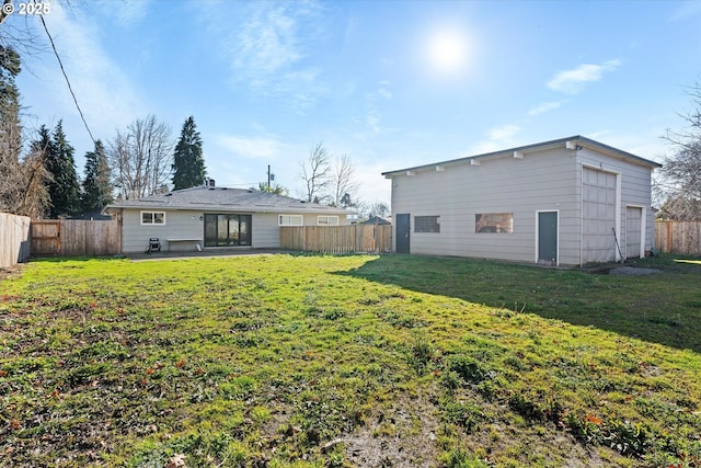 rear view of property featuring a yard