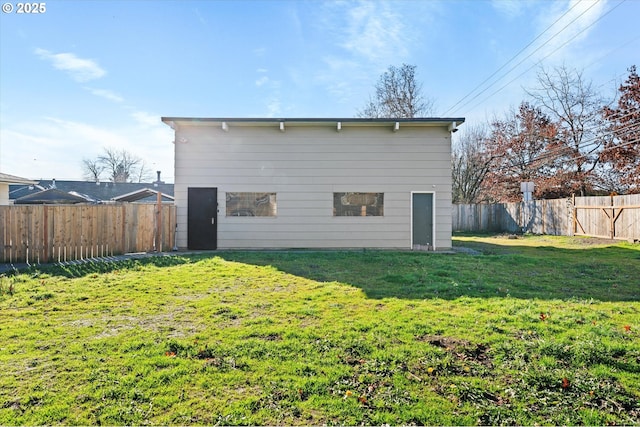 rear view of house with a lawn