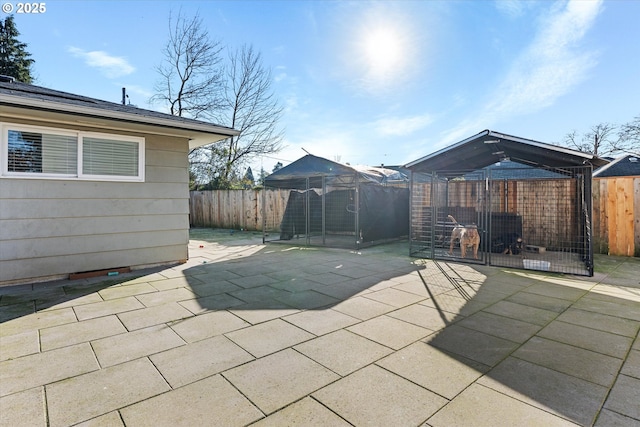 view of patio with an outbuilding