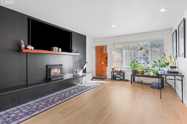 interior space with light hardwood / wood-style floors and a textured ceiling