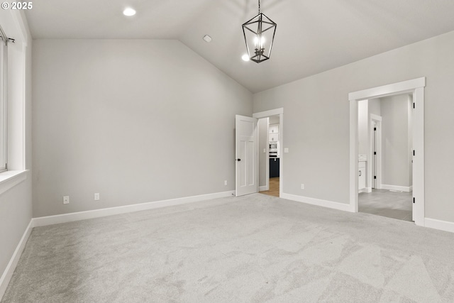 unfurnished bedroom with baseboards, lofted ceiling, carpet flooring, a notable chandelier, and recessed lighting