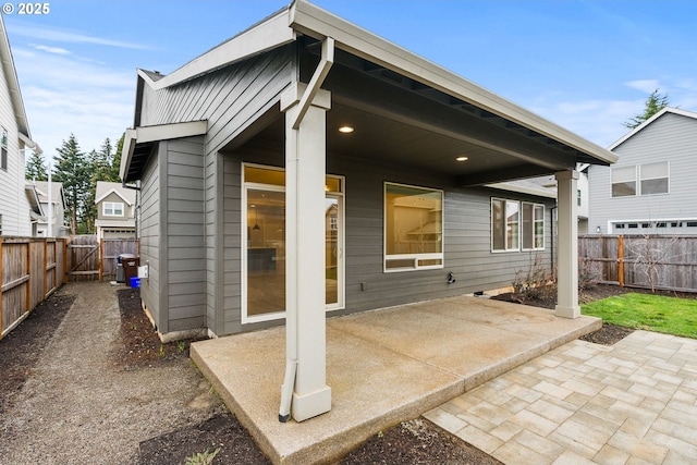 back of property featuring a patio area and a fenced backyard