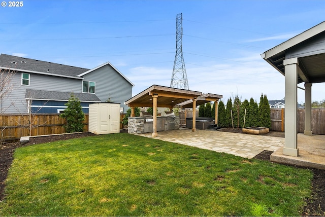 view of yard featuring a patio, an outdoor fire pit, area for grilling, and a fenced backyard