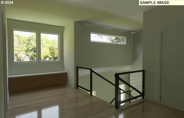 stairs featuring light wood-type flooring