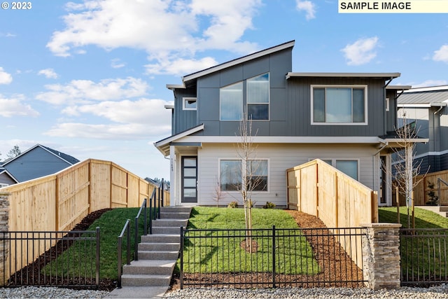 view of front of property featuring a fenced front yard and a front yard