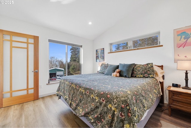9065 8th St, Bay City, OR 97107 - bedroom featuring vaulted ceiling, wood finished floors, baseboards, recessed lighting, and access to outside