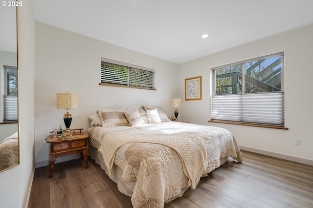 9065 8th St, Bay City, OR 97107 - bedroom featuring wood finished floors, recessed lighting, and baseboards