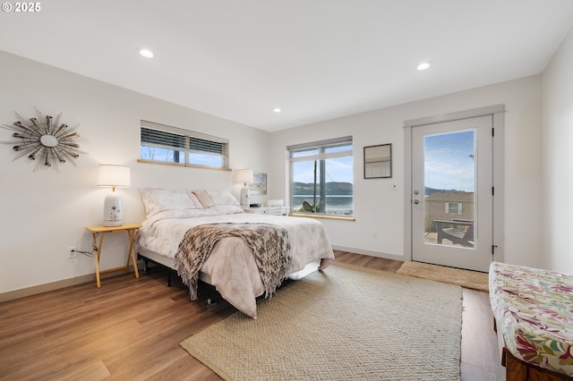 9065 8th St, Bay City, OR 97107 - bedroom with access to exterior, light wood-type flooring, recessed lighting, and baseboards