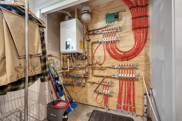 9065 8th St, Bay City, OR 97107 - utility room featuring tankless water heater