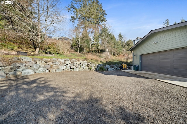 9065 8th St, Bay City, OR 97107 - view of yard featuring a garage