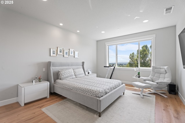 15180 SW Harveys View Ave, Tigard, OR 97224 - bedroom featuring light wood-style flooring, recessed lighting, and baseboards