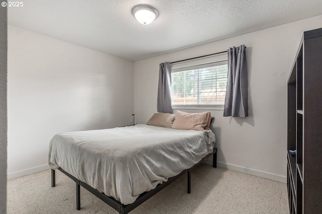 bedroom featuring a textured ceiling