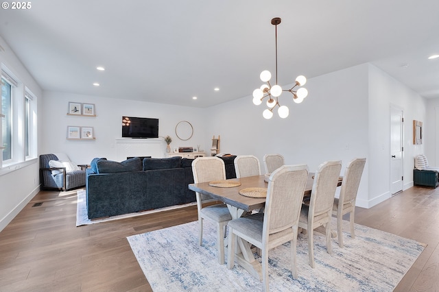 21773 SW Meadow Ter, Sherwood, OR 97140 - dining room featuring wood finished floors, recessed lighting, and a chandelier