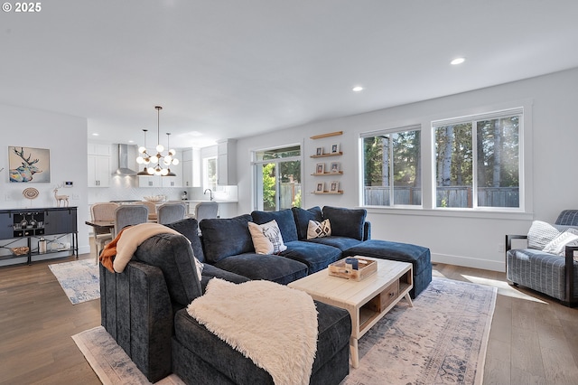 21773 SW Meadow Ter, Sherwood, OR 97140 - living room with a chandelier, recessed lighting, and wood finished floors