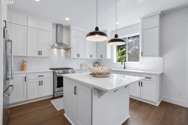 21773 SW Meadow Ter, Sherwood, OR 97140 - kitchen featuring wall chimney exhaust hood, stainless steel appliances, dark wood-type flooring, light countertops, and recessed lighting