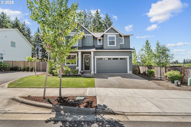 21773 SW Meadow Ter, Sherwood, OR 97140 - view of front of home with driveway, an attached garage, and board and batten siding