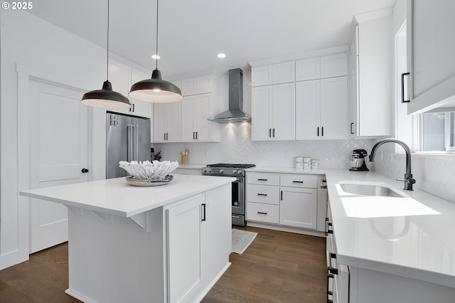 21773 SW Meadow Ter, Sherwood, OR 97140 - kitchen featuring wall chimney range hood, stainless steel appliances, white cabinets, backsplash, and recessed lighting