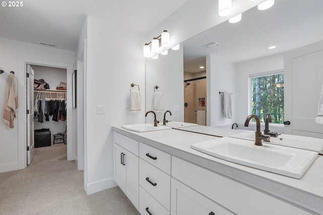 21773 SW Meadow Ter, Sherwood, OR 97140 - full bath featuring a stall shower, double vanity, a walk in closet, tile patterned floors, and recessed lighting