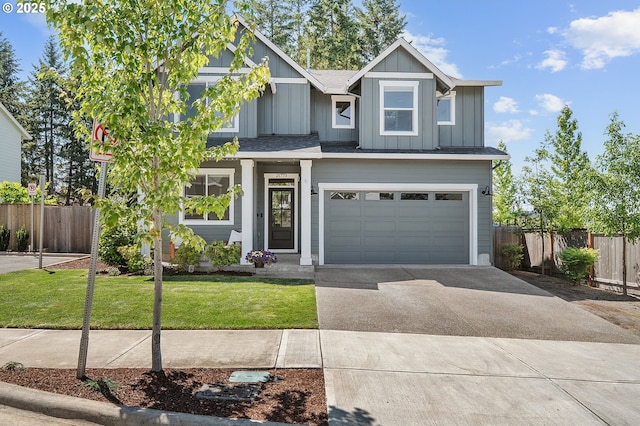 21773 SW Meadow Ter, Sherwood, OR 97140 - view of front facade with driveway, an attached garage, and board and batten siding