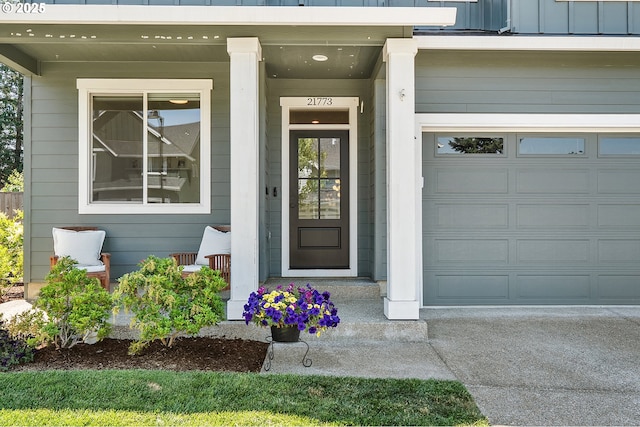 21773 SW Meadow Ter, Sherwood, OR 97140 - doorway to property featuring a garage and a porch