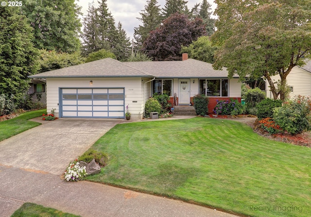 single story home with driveway, a shingled roof, an attached garage, a front yard, and a chimney