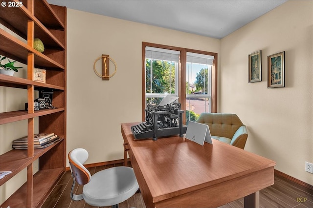 office space featuring baseboards and dark wood-style flooring