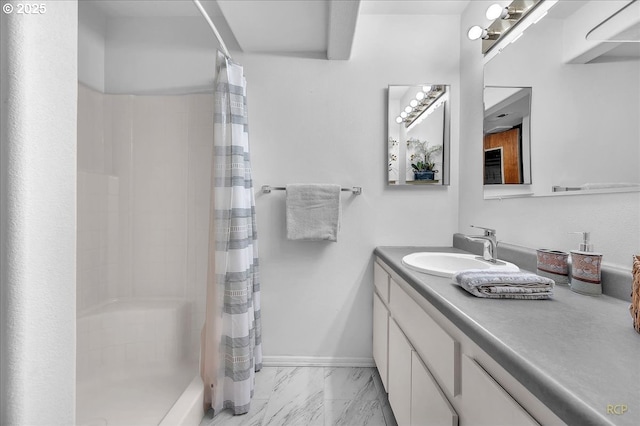 full bathroom with marble finish floor, baseboards, vanity, and a shower with shower curtain