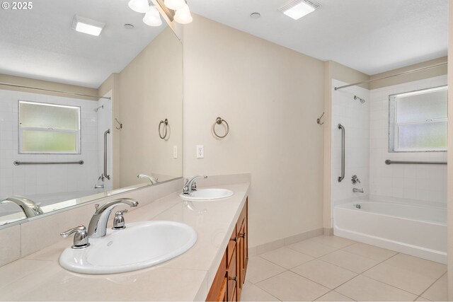 full bathroom featuring tile patterned flooring, a wealth of natural light, and a sink