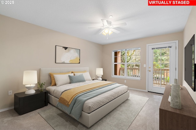 bedroom featuring baseboards, light carpet, and access to outside