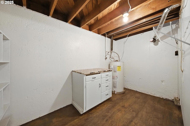 720 NW Johns Pl, Pendleton, OR 97801 - unfinished basement featuring electric water heater and dark wood-style floors