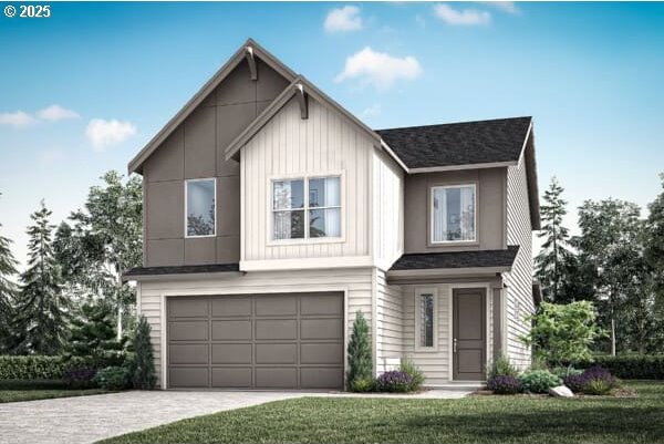 2261 Ash St Unit 90, Woodland, WA 98674 - view of front of home featuring a garage and a front yard