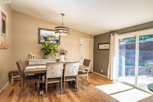 1950 Byron Creek Rd, Winston, OR 97496 - dining space featuring lofted ceiling, light wood-style floors, baseboards, and a chandelier