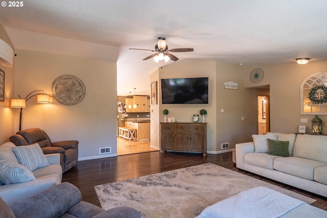1950 Byron Creek Rd, Winston, OR 97496 - living room featuring ceiling fan, dark wood-style floors, vaulted ceiling, and baseboards