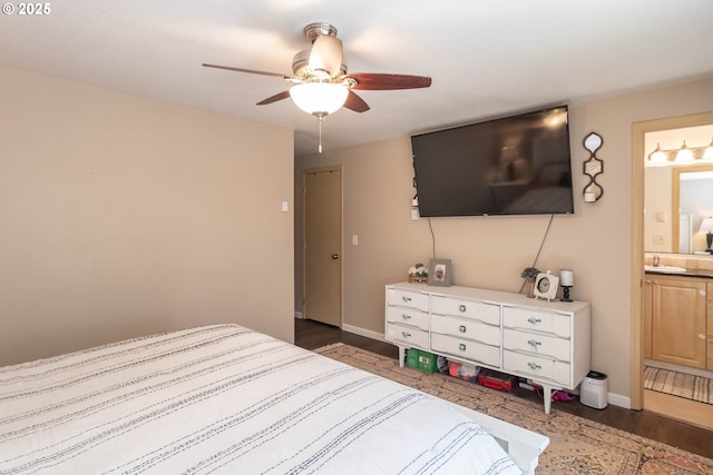 1950 Byron Creek Rd, Winston, OR 97496 - bedroom with wood finished floors, connected bathroom, baseboards, and ceiling fan