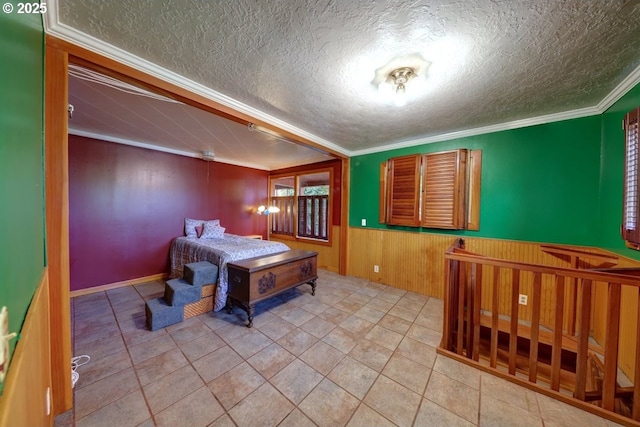 3162 Marine Dr, Astoria, OR 97103 - playroom featuring crown molding, a textured ceiling, wainscoting, and wood walls
