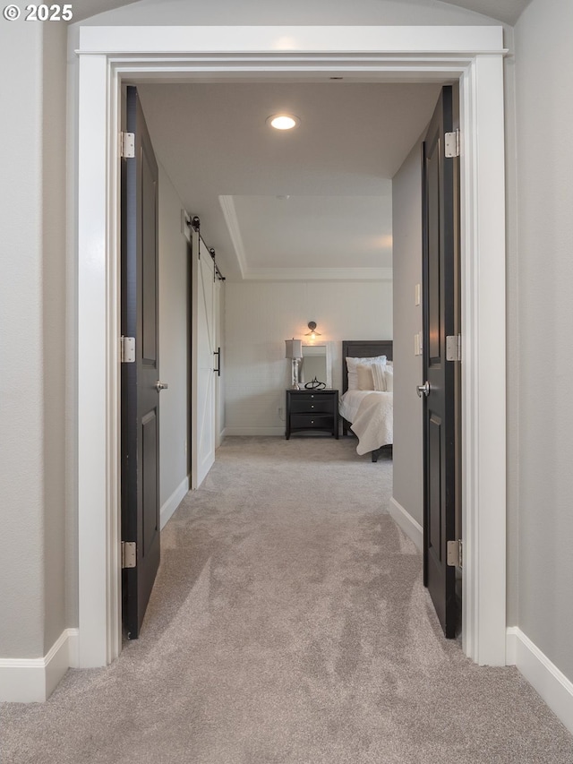 7882 SW Cinnabar, Wilsonville, OR 97070 - hallway featuring light colored carpet, a barn door, and recessed lighting