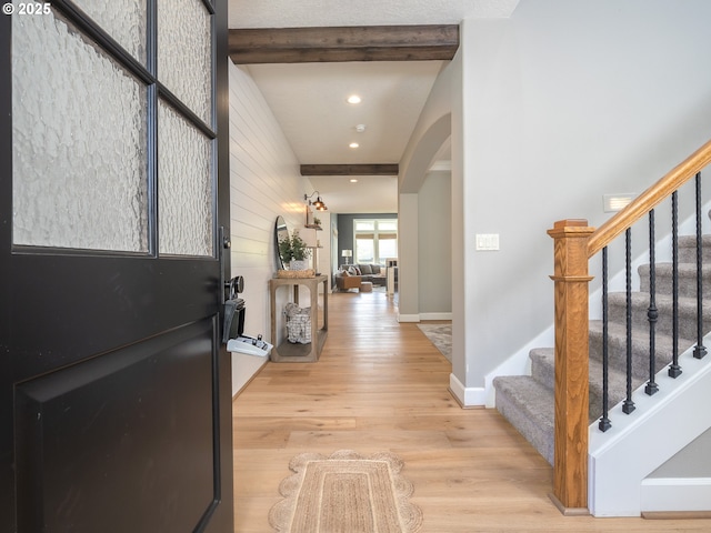 7882 SW Cinnabar, Wilsonville, OR 97070 - entrance foyer featuring arched walkways, beamed ceiling, light wood-style flooring, stairs, and recessed lighting