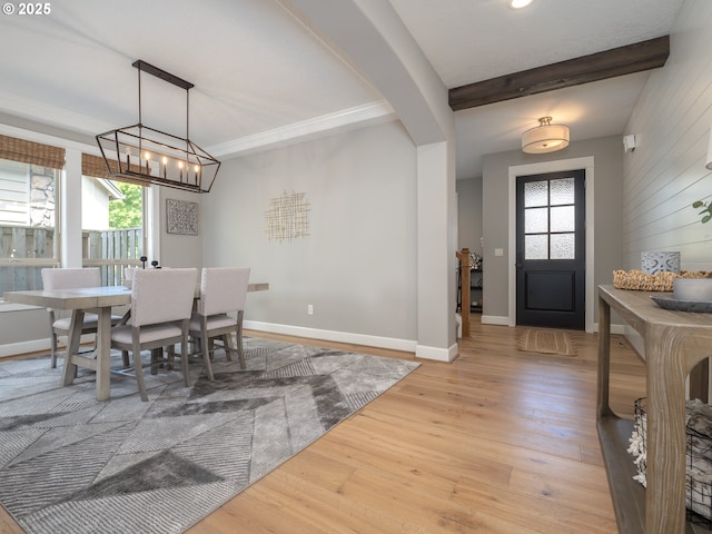 7882 SW Cinnabar, Wilsonville, OR 97070 - dining space featuring healthy amount of natural light, light wood-style flooring, a chandelier, and beamed ceiling