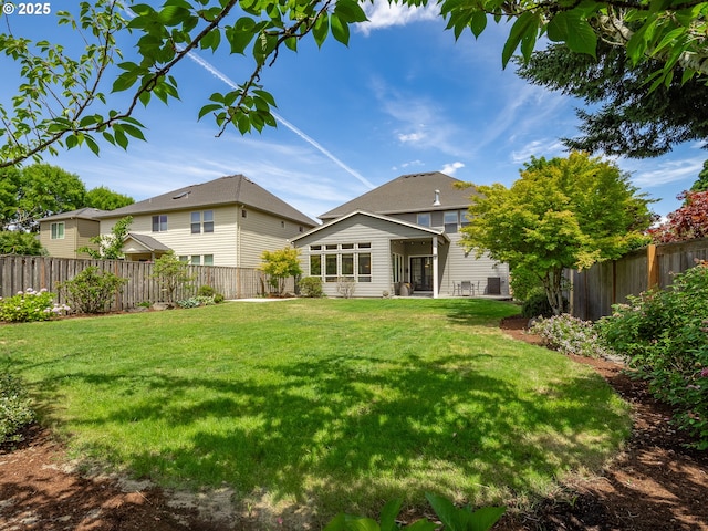7882 SW Cinnabar, Wilsonville, OR 97070 - back of house featuring a fenced backyard and a sunroom