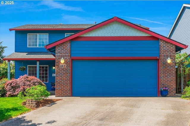 287 SW Oliver Ct, Dundee, OR 97115 - view of front of house with an attached garage, concrete driveway, and brick siding
