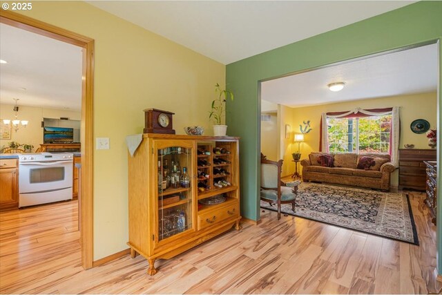 287 SW Oliver Ct, Dundee, OR 97115 - living area with light wood-type flooring and a chandelier
