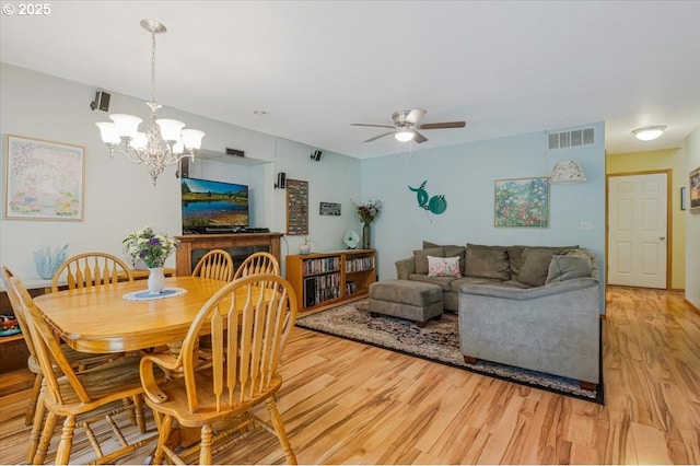 287 SW Oliver Ct, Dundee, OR 97115 - dining area featuring light wood-style floors, a ceiling fan, and a chandelier