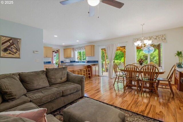287 SW Oliver Ct, Dundee, OR 97115 - living room with light wood finished floors, a chandelier, a ceiling fan, and recessed lighting