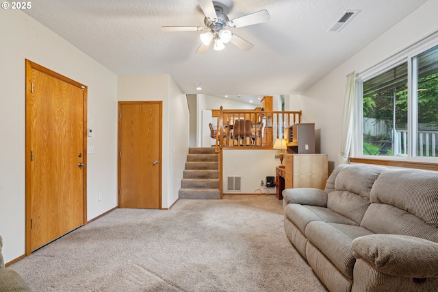 17701 Koch Ct, Sandy, OR 97055 - living area with light carpet, ceiling fan, and stairway
