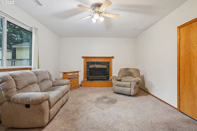 17701 Koch Ct, Sandy, OR 97055 - living room featuring light carpet, ceiling fan, and a tile fireplace