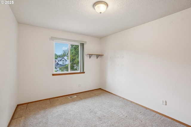 17701 Koch Ct, Sandy, OR 97055 - empty room featuring carpet, baseboards, and a textured ceiling