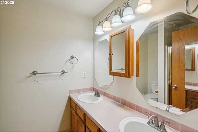 17701 Koch Ct, Sandy, OR 97055 - bathroom featuring double vanity and toilet