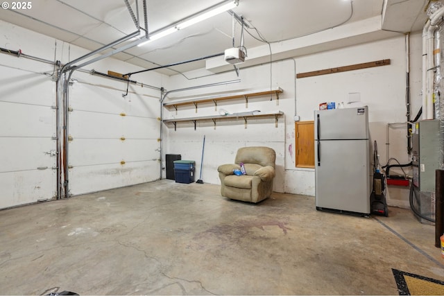 17701 Koch Ct, Sandy, OR 97055 - garage with freestanding refrigerator and a garage door opener